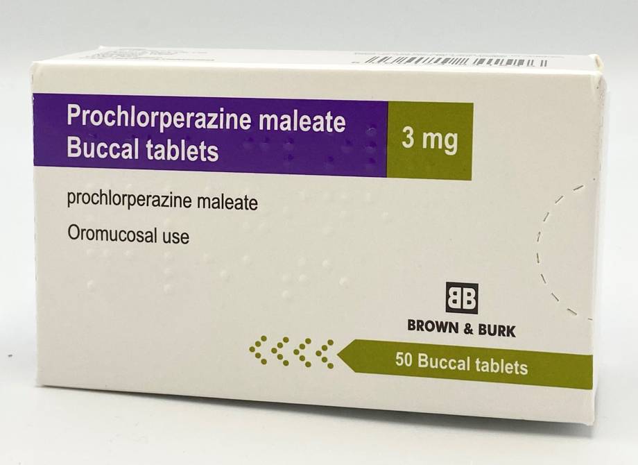 A small white cardboard box. A block of dark purple is at the top and left, inside the block is white text "Prochlorperazine maleate buccal tablets". Next to the purple block is a green/gold block with 3 mg. There is more text on the box. There appears to. 