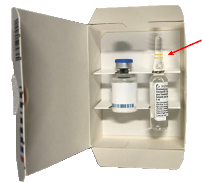 A small cardboard box containing a glass vial and a glass ampoule. The ampoule is the water for injection and there is a red arrow pointing at the ampoule to indicate which product has the issue. . 