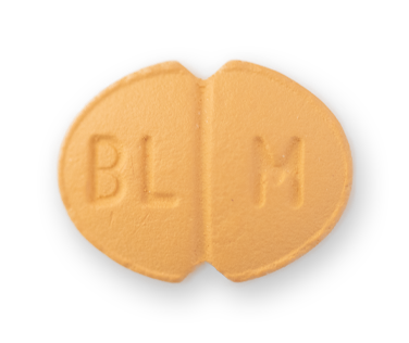A light-orange oval pill, with indents on the long side. There is a centre score and the letters BL M etched on it.