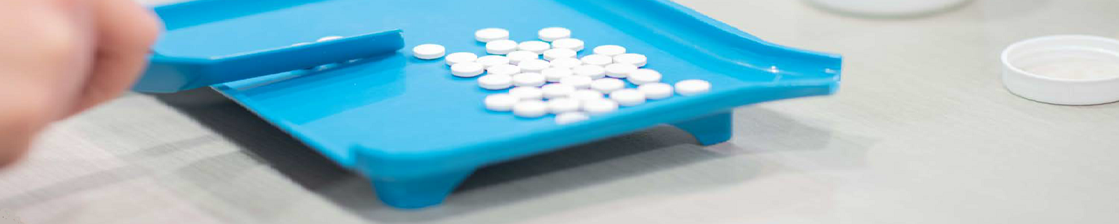 pills on a dispensing tray. 